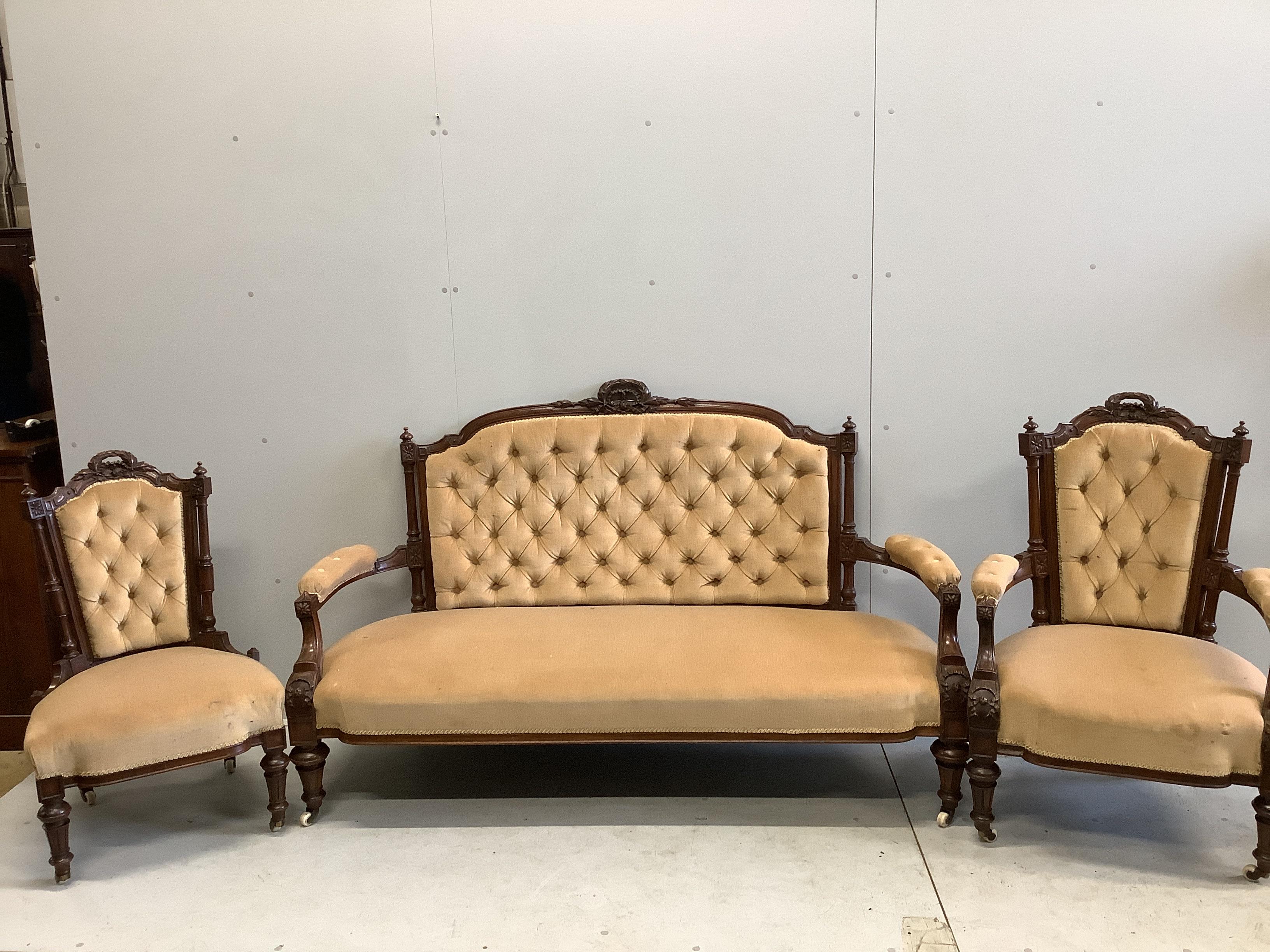 A Victorian carved walnut three piece salon suite, width 170cm, depth 60cm, height 104cm